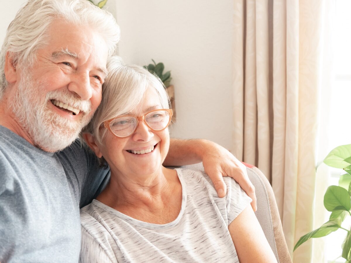 Happy couple with conservatory extension installation