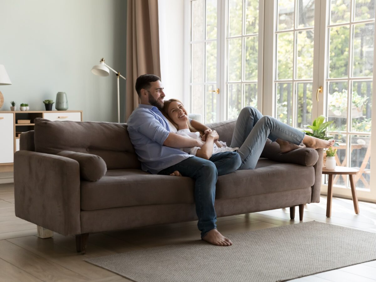 Happy couple with conservatory extension installation
